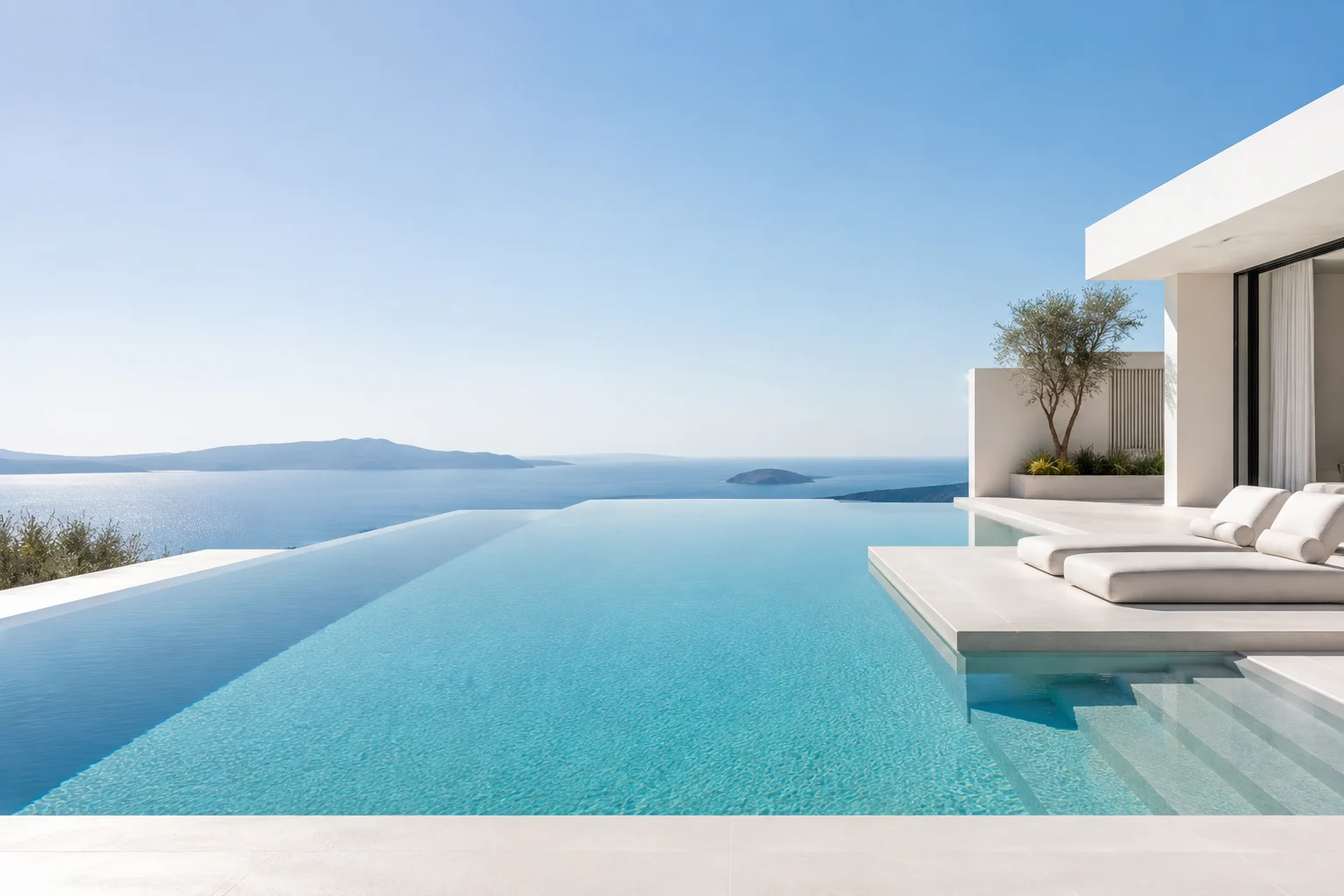 An inviting blue infinity pool beside a sunlit terrace
